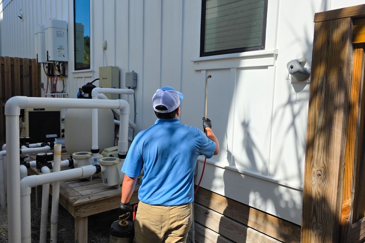 TruNorth Pest Control technician treating a home in Poinciana FL